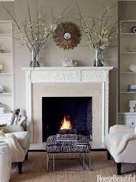 Here S How To Decorate Your Fireplace So It Looks Stylish All Year Long Beige Living Rooms Fireplace Seating Perfect Living Room