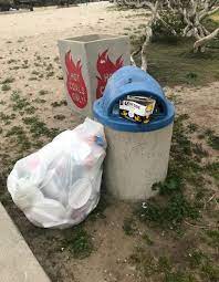 The Problem With Overflowing Trash Cans Is Much Of It Gets Blown Back Into The Ocean Or The Birds Carry It Off And Again It Lands Trash Cans Trash Beach Toys