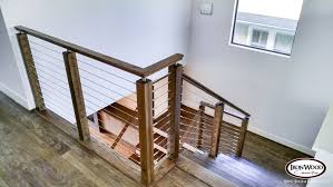 This Design Was Created With An Ironwood Connection Cable Rail Kit This Staircase Uses Marine Grade Stainless Steel Cable Stairs Stair Remodel Interior Stairs