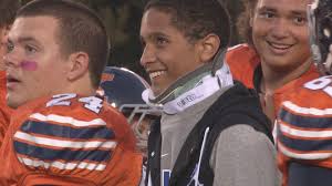 Injured Kingston football player cheers