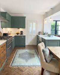 What escalates this room from familiar to fabulous, however, are the unexpected metallic gold cabinets. A Colorful Uk Home Features The Neatest Wooden Apothecary Drawers In The Kitchen Home Kitchen Renovation Kitchen Design