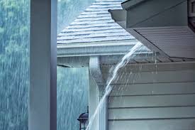 Dab roofing cement on the nail heads, under each shingle tab, and in any gaps between the shingles to keep water from getting underneath the diverter. Drawing Water Away From The House