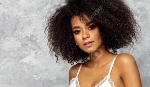 In the 1960s, afro hairstyles became a sign of black acceptance and the defining image of the wave of black supremacy. Beautiful Black Woman With An Afro Hairstyle Wear White Bra And Stock Photo Picture And Royalty Free Image Image 112448966