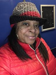 My first An attempt at Georgia O'Keeffe (note the poppies and an attempt at  a cow skull) Feel like she needs a hat vs the bonnet and a more somber  smile, but