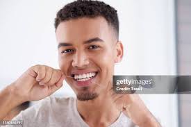 1.296 Person Flossing Stock Photos, High-Res Pictures, and Images