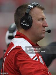 Nick Toon of the Wisconsin Badgers runs past Shane Potter of the... News  Photo