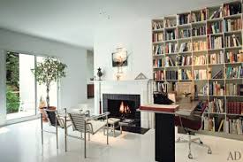 Masculine home library with modern leather chair. 35 Home Library Ideas With Beautiful Bookshelf Designs Architectural Digest