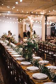 This Vintage Industrial New Year S Eve Wedding At Brik Venue Was A Night To Remember Junebug Weddings Industrial Wedding Table Industrial Wedding Table Decorations New Years Wedding
