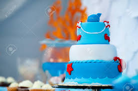 It's 'cuz he's about to get his face eaten! Huge Blue And White Birthday Cake With Sweet Crab Fish Starfish Stock Photo Picture And Royalty Free Image Image 118151612
