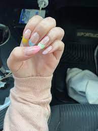 If a true french manicure is a little too throwback for you, plant the style firmly in 2020 with glittery gold tips. Pastel Rainbow French Tips Nails