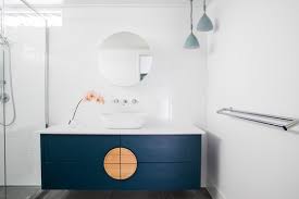 A list of modern bathroom wall decor ideas filled with funny prints, wall plaques, industrial shelving, modern geometric tiles, and quirky toilet toilet utility patents: 8 Navy Blue Bathroom Vanity Ideas The Plumbette