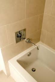 What you pay depends on materials and the labor required for plumbing, tile work, and electrical work. How To Tile Around A Bathtub Edge Mold In Bathroom Shower Remodel Bathtub Tile