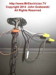 Because most ceiling fans are heavier than the average light fixture, the ceiling electrical box and wiring can be used. Close Shot Of Light Fixture Chain Hanging From Ceiling With The Wires Spliced And Hanging Out Of The Octagonal Ceiling Lights Light Fixtures Light Installation