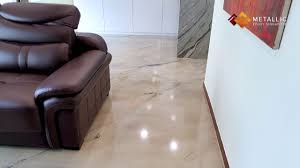 The living room has ebony, fired oak floors and a white ceiling, while the stepped up library has a white epoxy resin floor with an ebony oak ceiling. Metallic Epoxy Flooring Design Gold And Black Veins On Khaki Base Living Room Floor Youtube