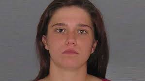 Police: Woman tries to run over officer with car