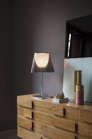 Perfect for a night stand or desk, philippe starck's table lamp incorporates a delightful duality of function. Miss K Table Lamp In Silver Black Or Red Modern Table Lamp Design Modern Table Lamp Flos
