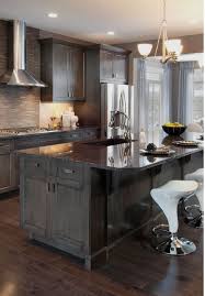 25 Ways To Style Grey Kitchen Cabinets Modern Kitchen Kitchen Decor Modern Stained Kitchen Cabinets