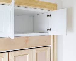 Small kitchens can be challenging when it comes to storage, but you can easily create more by adding a small extra shelf in your upper cabinets. Adding Extra Deep Cabinets Above Our Closet Yellow Brick Home