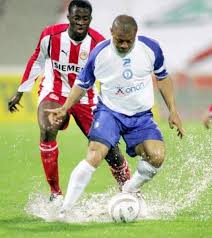 Ζοέλ Επαλέ απέναντι στον Γιάγια Τουρέ... Εκείνο το βροχερό απόγευμα εν έτει 2006, ο Επαλέ έκανε ότι ήθελε τον Ολυμπιακό στο Καυτατζόγλειο!