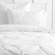 Choices include breezy linen and quality cotton in solid colors. White Floral Pom Cotton Quilt Sham