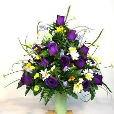These are gorgeous spring colors of yellow, purple, & green permanent cemetery vase arrangements. Spring Cemetery Vase Flower Arrangement Featuring Purple Roses And Wildflowers Flower Vase Arrangements Memorial Flowers Flower Arrangements