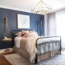 The beauty of gray is that even when it's used subtly—as in the case with these painted chairs—it still stands out, especially when paired with bright colors like this cobalt blue oushak rug. Bedroom Navy Blue Accent Wall With Gray Walls Novocom Top
