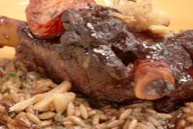 Get Bobby Flay S Oven Roasted Lamb Shanks With Roasted Tomatoes And Toasted Orzo Recipe From Food Network Roasted Lamb Shanks Lamb Shanks Lamb Recipes