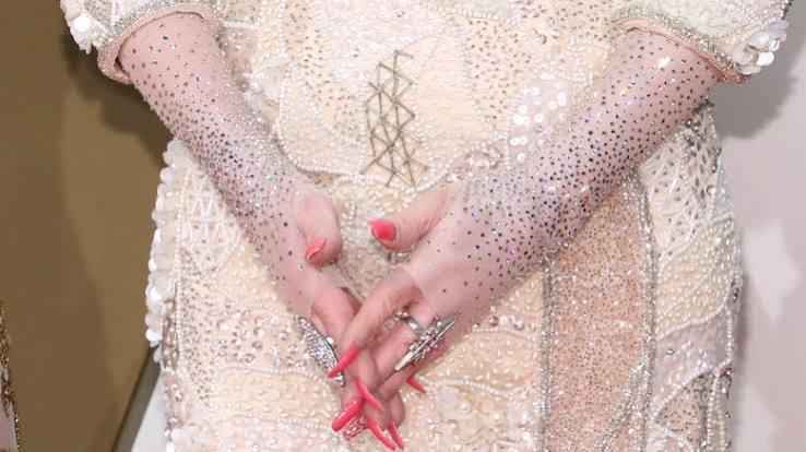 Why Dolly Parton Wears Long Sleeves All The Time