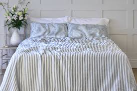 Duvet cover has a hidden button closure; Stone Blue Ticking Linen Bedding Bundle Chalk Pink Linen Company