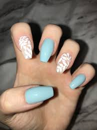 This color reminds us so much of frozen! Blue Acrylic Coffin Nails With White Leaf Nail Art Nails Cute Acrylic Nails Daisy Nails