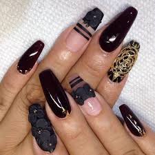 Coffin Black And Clear Acrylic Nails Floral Shapes Made From Black Acrylic Decorating Some Of The Nails Of Two Hands The Other Nails Are Either Smo In 2020 Coffin Shape Nails Nail Designs Nail Art Jewelry