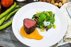 Tender and juicy beef tenderloin roast made with a simple garlic marinade and baked in the oven to perfection. Roasted Beef Tenderloin With Vegetables And Romesco Sauce Good Steak Recipes Beef Beef Dishes