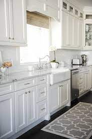 But the lightness opens up it's a beautiful, family kitchen with all the needs and accents you'd want. Gray Kitchen Rug Transitional Kitchen Tracey Ayton Photography
