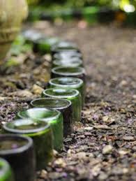 After The Party 5 Ways To Upcycle Wine Bottles Wine Bottle Garden Garden Edging Bottle Garden