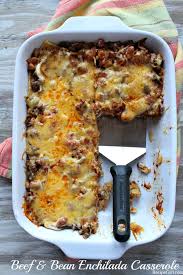 It's made with layers of tortillas, ground beef, cheese, and peppers. Beef And Bean Enchilada Casserole Recipe Girl