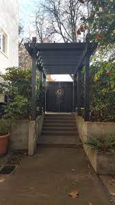 View From Inside Sunken Japanese Garden Entry And 20 Tall Hallway Pergola Over Steps At Be 1 Organics U S Headquarte Pergola Pergola Walkway Outdoor Pergola