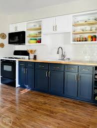 Love The Dark Blue With The Butcher Block Countertops And The White Upper Cabinets This Kitchen W Kitchen Renovation New Kitchen Cabinets Reface Cabinet Doors