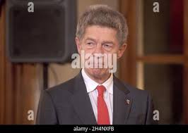 German Chancellor's husband Joachim Sauer and French First Lady Carla  Bruni-Sarkozy pose with first ladies during the spouses evening in Baden  Baden, Germany