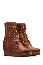 I love how these boots can be casual or dressed up. Sorel Joan Of Arctic Waterproof Wedge Boot Nordstrom Rack