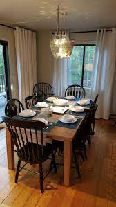 A Collection Of Mismatched Spindle Back Dining Chairs Is Unified With Mismatched Living Room Furniture Quality Living Room Furniture Traditional Dining Chairs