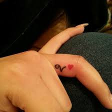 Best Initial Tattoo Designs Get Permanent Initial Tattoos Of Loved One Name Styleswardrobe Com Initial Tattoo Heart Tattoo Heart Tattoo On Finger