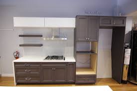 Wooden table on defocuced window with curtain background. Wood Mode Matte Twilight Kitchen Cabinets Refind Kitchens