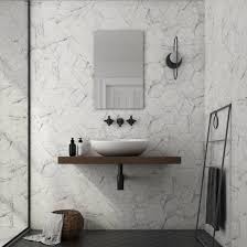 If you've chosen something different for the walls, you can add a trendy look to the bathroom cladding the floor with hexagon tiles, larger or smaller ones. Hexagon Carrara Marble Effect Wall Floor Tiles Marble Effect Tiles From Tile Mountain