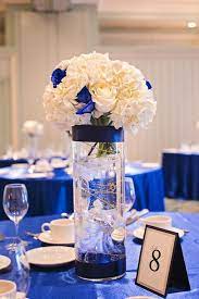 25 Breathtaking Wedding Centerpieces Trending For 2020 Pouted Com Blue Wedding Centerpieces Gold Wedding Decorations Royal Blue Wedding Decorations