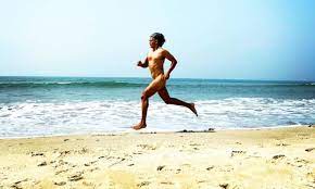 Running on the beach nude