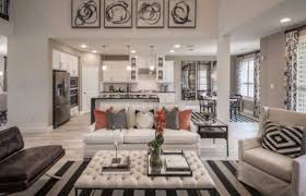 Salmon Slate And Silver Decor Bring This Lovely Living Room To Life Longmeadowfarms Houston Highlandhomes Home Family Living Rooms New Home Builders