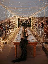 A Magical Santorini Wedding With Fairy Lights Tropical Florals Fairy Lights Wedding Wedding Lights Santorini Wedding