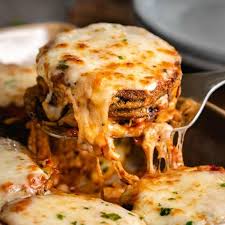 Eggplant Parmesan Being Pulled Up From A Casserole Dish With Hot Mozzarella Cheese On Top In 2020 Eggplant Parmesan Eggplant Recipes Parmesan Cooking