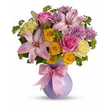 Graceful And Gorgeous Describes This Stunning Array Of Pastel Flowers In A Charming Lavender Vase Tied With A Pin Flower Delivery Easter Flowers Flower Cart