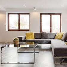 This large glass coffee table holds to a timeless rectangular shape that is also strong and looks fabulous. Large Corner Sofa And Glass Coffee Table In A Very Modern And Stock Photo Picture And Royalty Free Image Image 77351601